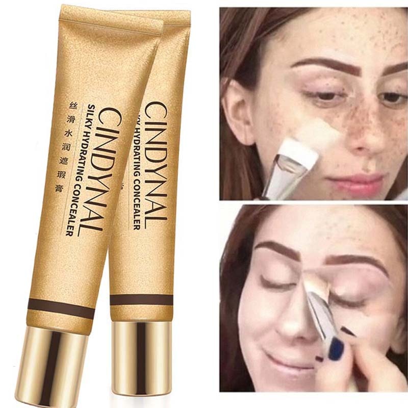 Small golden tube silky moisturizing nourishing concealer foundation cream to cover freckles acne spots and dark circles makeup