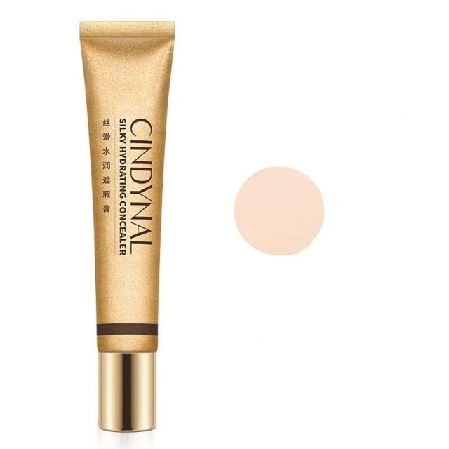Small golden tube silky moisturizing nourishing concealer foundation cream to cover freckles acne spots and dark circles makeup