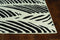 Rugs Black and White Rug - 23" X 45" X 0.'5" Black/White Polypropylene Rug HomeRoots