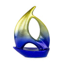 Sculptures Ceramic Sculpture - 9'.5" X 3'.5" X 12'.25" Yellow, Blue Ceramic Ombre Small Sailboat Sculpture HomeRoots